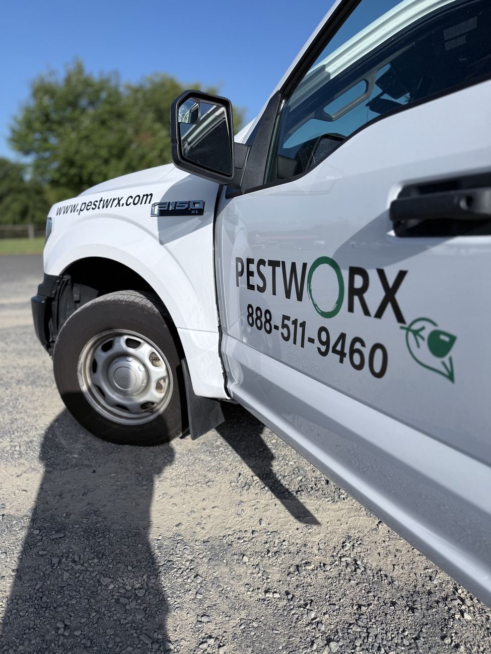 White Pestworx Ford F-150 service truck with the Pestworx logo and phone number 888-511-9460 on the door